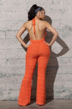 Elevate your summer style with the Chyna Sweater Jumpsuit. Crafted from sweater yarn, this long jumpsuit features an open back and wide legs for a breezy, boho-chic look. Its stretchy fabric ensures a comfortable, flattering fit. Perfect for beach outings, festivals, or casual summer events, this jumpsuit combines elegance with a relaxed vibe. The intricate crochet design adds a touch of sophistication, making it a versatile addition to your wardrobe. Stay stylish and comfortable all season long Orange Stretch Jumpsuits And Rompers For Spring, Wide Leg Stretch Jumpsuits And Rompers For Loungewear, Summer Stretch Jumpsuits And Rompers For Loungewear, Spring Backless Jumpsuits And Rompers For Loungewear, Non-stretch Wide Leg Jumpsuits And Rompers For Beach, Chic Orange Jumpsuits And Rompers For Beach, Chic Orange Jumpsuits And Rompers For Vacation, Chic Overall Bottoms For Vacation, Chic Orange Jumpsuit And Romper For Vacation