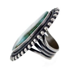 this absolutely stunning Navajo ring is a bold conversation piece handcrafted by the prominent Navajo artist E R B this ring spellbinds with its size as well as its beauty executed in the classic Navajo style the ring features a gorgeous and sizeable center piece of Royston turquoise stone measuring approximately 7/8" x 1 5/8" inlaid in sterling silver bezel this ring is a true showpiece handmade & stamped by E R B bezel and band handmade from .925 Sterling Silver size 9 approximate centerpi Vintage Chrysocolla Turquoise Ring, Artisan Turquoise Ring Round Collectible, Southwestern Style Cabochon Rings, Collectible, Southwestern Style Cabochon Ring Collectible, Artisan Round Turquoise Ring Collectible, Artisan Round Turquoise Collectible Ring, Southwestern Style Collectible Jewelry With Large Stone, Southwestern Gemstone Rings For Collectors, One-of-a-kind Oval Southwestern Jewelry