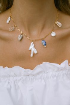 Our Mana necklace is your summertime vacay staple. Drift away to palm lined beaches, collecting shells, balmy summer nights & midnight swims. Paired beautifully with fresh sun-kissed skin & your favorite all white outfit. - 18k gold filled chain - Hand selected luminous freshwater baroque pearls - Lapis Lazuli - Quartz crystal - Mixed shells - Gold filled wire - Approx 16 inches end to end Gold filled jewelry is easily 100 times thicker compared to common gold plating & lasts just li Collecting Shells, All White Outfit, White Outfit, Funky Jewelry, Jewelry Lookbook, Shell Jewelry, Jewelry Inspo, Summer Jewelry, Gold Filled Jewelry