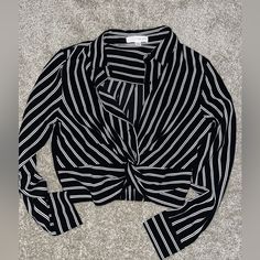 Crop-Style Long-Sleeve Top. Never Worn. Black And White Stripes With A Twist In The Front Smoke-Free & Pet-Free Home Trendy Black Blouse For Office Wear, Black And White Long Sleeve Tops For Fall, Black Long Sleeve Tops For Office, Black Long Sleeve Office Tops, Chic Striped Tops For Night Out, Black And White Long Sleeve Tops For Spring, Fitted Long Sleeve Black And White Tops, Fitted Black And White Long Sleeve Tops, Spring Workwear Black And White Tops