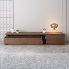 a modern wooden entertainment center in a living room with white walls and tile flooring