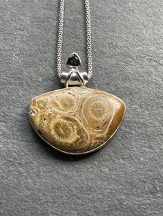 "Natural handcrafted Petoskey Stone and Smoky Topazpendant in 925 sterling silver and 1.5\" in height(including the bail). You can also purchase high quality 925 solid silver Italian popcorn chain that is 1.8 mm thick and with anti-tarnish finish. The chain is made in Italy and 925 stamped. ✓You purchase comes in the gift box ✓ Solid 925 Sterling Silver (925 parts per 1000) ✓ 925 Silver Hallmarked ✓ Every natural stone is different and exclusive in pattern and shape, and with its unique properti Untreated Sterling Silver Necklaces As Gifts, Untreated Silver Necklace As A Gift, Untreated Teardrop Pendant Necklace As A Gift, Untreated Teardrop Pendant Necklace For Gifts, Untreated Sterling Silver Necklaces In Silver, Silver Sterling Silver Necklace, Italian Popcorn, Petoskey Stone, Silver Necklace Pendant