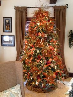 a decorated christmas tree in a living room