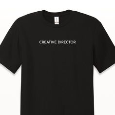 "With a minimalist design, The Creative Director Tee is excellent for any designer, illustrator, entrepreneur, business owner, creative maker, or anyone in charge of making high-level creative decisions. This lightweight crewneck is made of 100% ring spun US cotton, and has a modern classic fit. The neck and shoulders are taped for comfort and durability. Available in unisex sizing. None of that \"iron-on\" look or feel. Each garment is finished with commercial-grade heat press and vinyl." Modern Short Sleeve T-shirt With Branding, Modern Cotton T-shirt With Branding, Minimalist Graphic Print T-shirt With Short Sleeves, Relaxed Fit Crew T-shirt With Graphic Design, Relaxed Fit Graphic Crew T-shirt, Minimalist Short Sleeve T-shirt With Graphic Print, Minimalist Graphic Print Short Sleeve T-shirt, Minimalist Graphic Print T-shirt Relaxed Fit, Modern Branded Crew Neck T-shirt