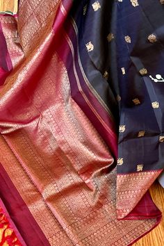 This banarasi inspired stunning kanjivaram saree in kanchana black is handwoven with traditional motifs in gold zari on the body. The borders in deep maroon have traditional motifs like floral, chakras and geometric patterns in gold zari. The grand pallu in deep maroon color mirrors the patterns of the borders in gold zari. Approximate Length 6.5 mtrs (inclusive of blouse length) Approximate weight - 1.5 lbs Approximate Height - 48 - 52" Saree comes with fall, picot and tassels done when applicable. Blouse piece is cut. Kindly Note : The colors you see on your device may vary due to the color reproduction, brightness and resolution of individual devices. If you'd like more clarity before your purchase, please contact our support team. Kanjivaram Sarees, Silk Cotton Sarees, Maroon Color, Blouse Length, Blouse Piece, Cotton Saree, Silk Blouse, Silk Sarees, Checks