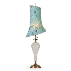 a lamp with a blue and white shade on the bottom is shown in front of a white background