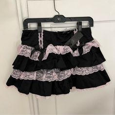 Nwt - Widow X Dolls Kill The Cake Topper Mini Skirt - M This Black And Pink High-Waisted Mini Skirt Has A Tiered Non-Stretch Construction, Contrast-Colored Baby Pink Lace Trim, Black Bow Appliques, And A Back Zip Closure. Perfect Pastel Goth Piece!! Measurements: Waist - 30” Length - 13.5” Sold Out Online!! #Pastelgoth #Kawaii #Pastelpunk #Coquette #Dollette #Cutecore #Cosplay #Egirl Pink And Black Mini Skirt, Pink And Black Goth Outfit, Cutecore Cosplay, Cutecore Skirt, Pink And Black Coquette, Pink Goth Outfits, Pastel Goth Skirt, Lifestyle Organization, Shoujo Fashion