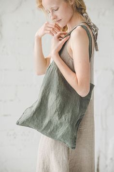 "DETAILS *Multi functional bags - never enough! *Linen bags will assist you while shopping, preparing for the beach, adding lunch for a work, etc. *These bags are suitable as a gift bag too *Made from soft wash medium weight (185 g) 100 % European linen fabric *Color - sage green. Available in 11 colors. Please choose another color on the right *Handmade in Lithuania by creative tailors CARE LABEL * machine wash gentle (40 C/104 F) * dry gentle on low heat * wrinkles give the character so there Summer Tote Lunch Bag For Daily Use, Eco-friendly Summer Bags With Pockets, Eco-friendly Everyday Gift Bags, Summer Bags With Pockets For Daily Use, Everyday Tote Bag With Adjustable Straps, Green Summer Shoulder Bag For Everyday Use, Green Beach Bag With Adjustable Strap For Everyday, Green Summer Shoulder Bag For Everyday, Green Bags With Adjustable Straps For Daily Use