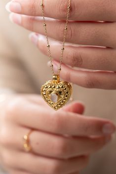 The Wishing Locket Collection is made up of beautiful handcrafted gold vermeil lockets, suspended on gold vermeil chains.  Each Wishing Locket can be filled with a personalised note - a wish, affirmation, vow, mantra, prayer or even a secret message from a loved one. Ever-present, the wearer holds the locket close to their heart. Choose from a selection of messages, or place something of your own in the locket of your choosing. We love the idea that putting a message out into the universe will h Elegant Gold Heart Necklace For Keepsake, Keepsake Yellow Gold Filigree Jewelry, Elegant Gold Heart Keepsake Necklace, Gold Plated Heart Locket Pendant Necklace, Spiritual Yellow Gold Necklace With Heart Charm, Yellow Gold Brass Necklace For Keepsake, Gold Open Heart Locket Necklace Gift, Brass Heart Charm Necklace For Wedding, Gold Plated Heart Pendant Locket Jewelry