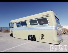 an old bus parked in a parking lot