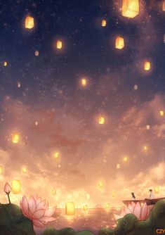 the sky is filled with floating paper lanterns