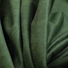 a close up view of a green fabric