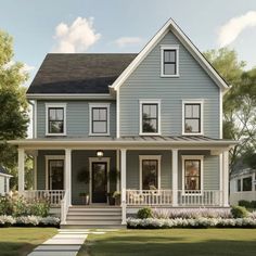 a blue house with white trim on the front porch and stairs leading up to it