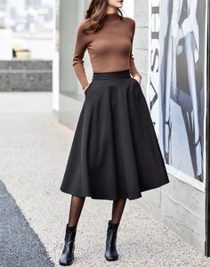 "Classic black skirt，Never go out of style，Lean and versatile. simple and elegant style suits wearing every occasion, working, shopping, weekend..soft and breathable fabric will let you act freely. Wear them with your favorite tops, such as short sleeves, suspenders, coats, and shirts...etc DETAILS: * 90% cotton, others are polyetser * Polyester lining * Two side pockets * Right zipper closure * High waistband * Elastic back waist * Black Circle skirt * Retro skirt * Perfect for spring and summer * Learn More about the items From the FAQs on the page bottom * The model is 170cm (5′7″) tall with a 80cm (31.5\") bust, 66cm (26\") waist. She is wearing in size XS. CUSTOM MADE SERVICE If you * Change other color * Can't find your size in our size Chart * Change the length * Your Height is not Circle Skirt Work Outfit, Black Skirt Combination, Black Skirt Medium Length, A Line Work Skirt, Sophisticated Rock Style, Black High Waisted Skirt Outfit, Black Winter Skirt Outfit, Black Skirt Business Casual, Styling A Line Skirt