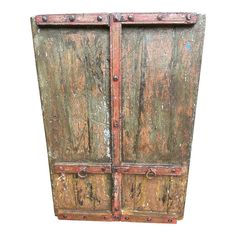 an old wooden door with rusted paint and rivets on the doors is isolated against a white background