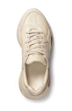 Featuring an interlocking G-logo and classic stripe motif inspired by an '80s-era design, this layered, retro-cool sneaker is boosted by a super chunky sole. Style Name:Gucci Rhyton Logo Sneaker (Women). Style Number: 5633696. Available in stores. Gucci Sneakers With Contrast Sole For Streetwear, Gucci Low-top Sporty Sneakers, Gucci Sporty High-top Sneakers, Gucci Sporty Low-top Sneakers, Gucci Sporty Sneakers For Streetwear, Sporty Gucci Sneakers With Contrast Sole, Gucci Leather High-top Sneakers Sporty, Sporty Gucci White High-top Sneakers, Gucci Classic Sneakers For Streetwear