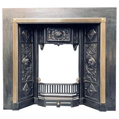 an ornate black fireplace with gold trimmings and carvings on the front door frame