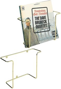 a magazine rack with a book on it and an advertise for the cover