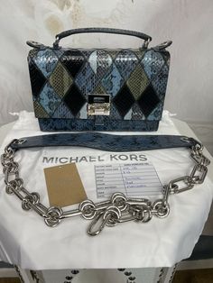 Michael Kors Collection Patchwork snakeskin Bancroft Bag. Shipped with USPS Priority Mail. Description This amazing bag is made of genuine snakeskin done in a diamond patched pattern! Stunning! Absolutely gorgeous...BRAND NEW! This Michael Kors collection bag was made in Italy by the finest artists, with the finest materials..... Don’t be the one carrying the average bag... get this top of the line bag at a HUGH DISCOUNT! Crafted in Italy from smakeskin and calf leather, the Bancroft shoulder ba Designer Square Satchel With Branded Hardware, Designer Multicolor Rectangular Satchel, Luxury Multicolor Leather Bag, Designer Multicolor Rectangular Shoulder Bag, Designer Blue Square Satchel, Designer Multicolor Leather Shoulder Bag, Luxury Multicolor Square Bag, Designer Multicolor Shoulder Bag With Branded Hardware, Multicolor Rectangular Bag With Silver-tone Hardware