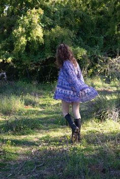 Our beautiful Sienna dress with its signature Blue Boheme silhouette and beautiful blue color is an unforgettable beauty and the ultimate bohemian glamour.Sizes: SM & ML100% Cotton | Color: Liberty BlueModel Height: 5'7Bust: 32BWaist: 24Hips: 32 Hippie Blue V-neck Dress, Peasant Boho Dress For Beach In Fall, Peasant Style Boho Dress For Beach In Fall, Blue Boho Beach Dress For Fall, Bohemian Mini Dress With Boho Print For Day Out, Bohemian Tunic Boho Dress For Spring, Blue Flowy Hippie Dresses, Blue Flowy Mini Dress For Fall, Flowy Free-spirited Boho Dress For Spring