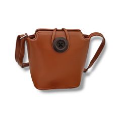 This gorgeous small brown faux leather cross body bag with a long extendable strap. Outside, there's a zipped compartment on the back of the bag. Inside, there's a zipped compartment in the center and a zipped compartment on the inside wall of the bag. There is also another open pocket on the opposite wall. The strap is removable and adjust to 140cm (55 inch), which makes it ideal for wearing across the body or over the shoulder. The base of the bag is sturdy and features silver colored zip fast Faux Leather Shoulder Phone Bag, Faux Leather Portable Shoulder Phone Bag, Portable Faux Leather Shoulder Phone Bag, Faux Leather Shoulder Bag For Everyday Use, Brown Phone Bag With Adjustable Shoulder Strap, Brown Shoulder Phone Bag With Adjustable Strap, Brown Phone Bag With Adjustable Strap, Portable Brown Crossbody Shoulder Bag, Brown Portable Crossbody Shoulder Bag