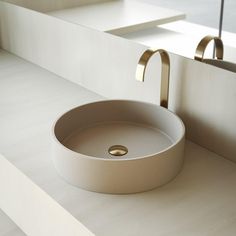 a white sink sitting on top of a counter