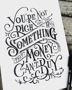 a hand lettered poster with the words you're not rich or have something that money can't buy