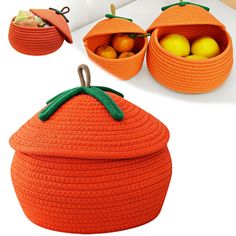 an orange basket with two apples in it and some other items on the table next to it