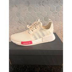 Elevate Your Style With These Adidas Nmd R1 Sneakers In A Chic Cream White Colorway. The Iconic Boost Midsole Offers Unparalleled Comfort For All-Day Wear. Perfect For Casual Outings, Gym Sessions, Or Adding A Sporty Touch To Your Everyday Look. The Distinctive Red Tab Adds A Pop Of Color, Making These Sneakers Stand Out. Ideal For Urban Explorers And Fashion-Forward Individuals Seeking Both Style And Comfort. Keywords: Adidas, Nmd R1, Cream White, Sneakers, Boost Technology, Casual Shoes, Athle Leopard Print Adidas, Adidas Nmd Black, Adidas Kids Shoes, Adidas Nmd_r1, Kids Soccer Cleats, Casual Athletic Shoes, Leopard Print Sneakers, Adidas Nmd R1, Nmd R1