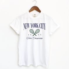 New York City, 1995 Tennis Championships Inspired by TJR's "Carrie Soto Is Back," this oversized tee is the perfect sporty addition to your bookish wardrobe. Printed on Comfort Colors, this tee is high quality & made to last with a soft, vintage look and feel! Features 100% ring spun cotton Fabric is created to be a softer, better quality fabric that feels “broken in” and soft for your skin Tee runs slightly big and has a wide boxy throw-back 90s style cut For size guide, view "Comfort Colors Te 90s Style White T-shirt For College, 90s Style White T-shirt, White Vintage T-shirt, Carrie Soto Is Back, Tennis Championships, Tennis Tshirts, Sporty Design, Shirt Design Inspiration, Tennis Shirts