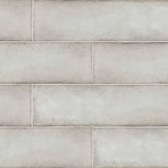 a white brick wall textured with cement