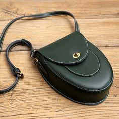 Overview: Design: Cute LEATHER Saddle Side Bag WOMEN SHOULDER BAG Crossbody Saddle Purse FOR WOMENIn Stock: 3-5 days For MakingInclude: A Shoulder BagCustom: NoLeather: CowhideMeasures: L 17cm x W 6cm x H 21cmWeight: 0.13 kgSlots: 1 main slot,Accessories(option): NoneStyle: Cute LEATHER Saddle Side Bag WOMEN SHOULDER BAG Crossbody Saddle Purse FOR WOMENVery durable (At least 5 Years) and it should last a life time Note: Each Item will have very slight variances to the pictured Item, and the cons Green Shoulder Saddle Bag, Handheld Saddle Bag For Everyday Use, Saddle Purse, Main Slot, Overview Design, Needle Felting Tutorials, Side Bag, Purse For Women, Women Shoulder Bag