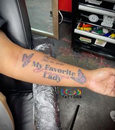 a woman's arm with the words my favorite lady tattooed on it