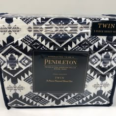 twin bedding set with black and white geometric print on the front, two pillow cases in