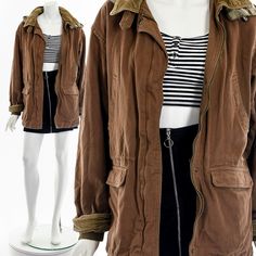 "- 70s/80s brown chore coat - corduroy and flannel detail - double pockets on front - metal zipper front closure - flannel lining - hidedn inside pocket - hood attached Fits like:  S - M Material:  Cotton Condition:  Great Clipped on Mannequin:  No ✂ SIZE + FIT ✂ Length: 30\" / 76 cm Shoulders, seam to seam: 20\" / 51 cm Sleeve Length: 23\" / 58 cm Bust: 42\" / 107 cm Waist: 44\" / 112 cm All measurements are taken with garment lying flat. ALWAYS refer to measurements as vintage sizes run can vary greatly from today's modern sizes. We recommend comparing measurements above with a similar style garment you own for best fit before purchasing.  DRESS FORM / MANNEQUIN is wearing the size detailed above but she typically measures a size 4/6 by modern retail sizes or a general size small. Belt A Brown Cotton Hooded Jacket With Pockets, Brown Utility Parka With Pockets, Brown Cotton Outerwear With Double-lined Hood, Brown Cotton Parka For Fall, Brown Hooded Utility Parka, Brown Utility Parka For Winter, Retro Hooded Jacket With Pockets For Fall, Vintage Brown Utility Jacket With Corduroy Collar, Brown Utility Jacket With Corduroy Collar