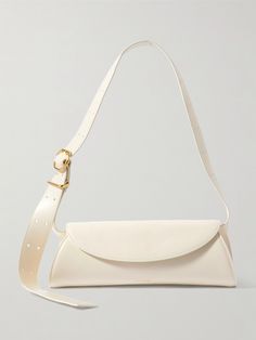 Jil Sander’s ‘Cannolo’ bag will slot nicely into your daily rotation thanks to its minimalist design and classic colorway. It’s crafted from leather and perfectly sized for the essentials, like your wallet, phone and keys. Remove the adjustable strap to carry it as a clutch. White Satchel With Smooth Grain, Modern Everyday Leather Baguette Bag, Minimalist Leather Baguette Bag For Everyday, White Baguette Bag With Dust Bag For Evening, White Baguette Bag For Evening With Dust Bag, Elegant White Bag With Smooth Grain, White Baguette Bag With Gold-tone Hardware For Evening, Formal White Bag With Smooth Grain, Elegant White Bags With Smooth Grain