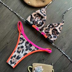 This sexy leopard print bikini is sure to turn heads and make a statement at the beach or poolThe backless halter top adds a touch of flirtiness, while the tie-side bottom allows for a customizable and comfortable fitMade from high-quality and stretchy material, this bikini is designed to hug your curves and create a flattering silhouette. Perfect for sunbathing or swimming, this bikini is a must-have for any fashion-forward beach-goerMaterial: NylonColors: ZY72001, ZY72002, ZY72003, ZY72004, ZY Leopard Print Swimwear For Beach Season, Leopard Print Triangle Top Swimwear For Pool, Leopard Print Stretch Swimwear For Pool, Stretch Leopard Print Swimwear For Pool, Leopard Print Swimwear For Sunbathing Beach Season, Summer Stretch Swimwear In Leopard Print, Leopard Print Halter Neck Swimwear For Swimming, Leopard Print Beachwear Swimwear For Sunbathing, Black String Swimwear For Beach