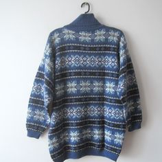 "Vintage Unisex Winter Holidays Sweater Ugly Party Turtleneck Jumper Knit Snowflake Pullover Blue Retro Sweater Christmas Jumper Size M/L Estimated size: Mens M; Women's L Measurements: (lying flat) Length - 28.5\"/ 72.5 cm Pit to pit: 22\"/ 56 cm Waist: 21.5\"/ 54.5 cm Shoulder: 22\"/ 56 cm Sleeve: 19\"/ 48 cm Please check measurements to insure a proper fit. Remember to allow yourself some extra room for movement. You can compare these with something from your closet that fits you well. This s Nordic Blue Crew Neck Sweater, Blue Nordic Crew Neck Sweater, Blue Turtleneck Sweater For Winter, Blue Nordic Knit Sweater, Blue Fair Isle Sweater For Cold Weather, Blue Crew Neck Cardigan For Winter, Nordic Knitted Blue Sweater, Blue Nordic Sweater With Fair Isle Pattern, Cozy Blue Sweater With Fair Isle Pattern