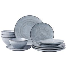 a stack of plates and bowls sitting next to each other