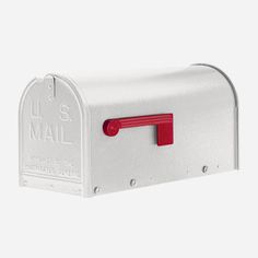 a white mailbox with a red handle on the front and bottom, is shown