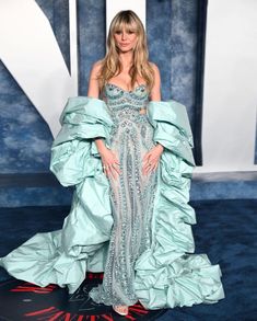 an image of a woman in a dress on the red carpet