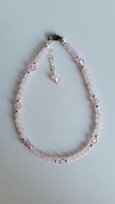 This anklet brings together Sterling Silver, matching Czech Crystal and Rose Quartz Gemstones. The Rose Quartz gemstone is a light pink color and is known as a romance stone and attracts love. It also helps to lower stress and tension in the heart. It clears out anger, jealousy and resentment of others. It clears the heart of any negative emotions allowing it to heal and is thought to aid in enhancing self-esteem and self- acceptance. The anklet has a 1" extension with a beaded drop making it ad Elegant Adjustable Pink Anklets, Elegant Pink Adjustable Anklets, Quartz Gemstones, Rose Quartz Gemstone, Light Pink Color, Czech Crystal, Quartz Rose, Negative Emotions, Anklet Jewelry