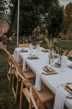 the table is set with place settings for dinner