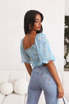 Length from shoulder to hem of size S: 34cm. Crop top. Partially lined. Cold hand wash only.鈥/li>Model is a standard S and is wearing size S.鈥/li>True to size. Lightweight and non-stretchy chiffon fabric. Slip-on style. Shirred and stretchy back. Polyester. Live among the stars, Across The Galaxy - it's time to stand out with your fave classic print. This floral crop features a lace-up front, short flowy sleeves and an asymmetrical hemline. Style yours with high-waisted jeans and braids. Flowy Sleeves, The Galaxy, Chiffon Fabric, High Waist Jeans, Off Shoulder Blouse, Going Out, Braids, Crop Top, Chiffon