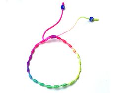 Colorful Adjustable Playful Friendship Bracelets, Playful Adjustable Multicolor Friendship Bracelets, Casual Rainbow Beaded Bracelets With Sliding Knot, Bohemian Rainbow Friendship Bracelets With Sliding Knot, Bohemian Rainbow Friendship Bracelet With Sliding Knot, Casual Multicolor Evil Eye Bracelet For Beach, Adjustable Rainbow Friendship Bracelets With Round Beads, Trendy Adjustable Multicolor Evil Eye Bracelet, Rainbow Friendship Bracelets With Round Beads