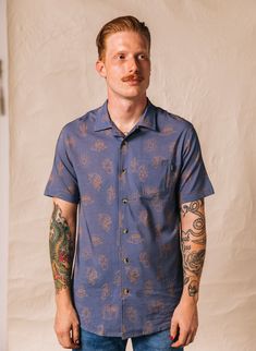 This men’s collared button-down shirt featuring burritos, cacti, margaritas, and our other favorite southwestern foods. Whether you’re buttoning it to the top or dressing it down with a graphic tee, you’ll stay comfy and cool all day long in this super-soft cotton blend shirt. Features: Super Comfy, Well Made Cotton Blend Unique All-Over Print Design Vacation Shirt Collar Tortoise Buttons Available in Chambray Blue Love the Fit? Then please hang dry! Do not put in the dryer. Food Socks, Food Shirt, Comfortable Loungewear, Eco Friendly Clothing, Innovative Fashion, Mens Button Up, Fleece Sweater, Organic Fabrics, Vacation Shirts