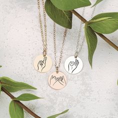 Treat your loved ones to something totally unique, totally creative, and totally YOU - the Hand Gestures Necklace. The perfect gift to let your friends and family know how much they truly mean to you! The coolest gift ever! Perfect for sharing your love with friends, sisters, and besties, our signature disc necklace features unique, hand-drawn expressions of sign language, designed by Melanie. Show your special someone just how much you care with a one-of-a-kind sign like 'I love you', 'peace', Drawn Expressions, Hand Gestures, 20 Inch Necklace, Hand Gesture, Princess Necklace, Heart Face Shape, Month Gifts, Wear Necklaces, Round Necklace