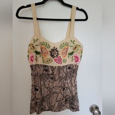 Never Worn Embroidered Tank Top From Anthropologie Size L. Perfect Summer Tank! I Don't Know The Brand. It's Not On The Tag. The Back Has Smocking For Stretch. Please Don't Hesitate To Ask Any Questions. I'm Happy To Answer. Thanks For Looking! Beige Cotton Top With Floral Embroidery, Fitted Cotton Tops With Tonal Embroidery, Fitted Embroidered Beach Top, Fitted Top With Multicolor Floral Embroidery, Fitted Top With Intricate Embroidery For Summer, Fitted Cream Tops With Floral Embroidery, Fitted Multicolor Embroidered Top For Spring, Fitted Embroidered Beige Top, Fitted Embroidered Top For Summer