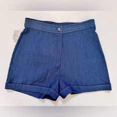 - New With Original Sears Tag - Vintage 70s Dark Denim Cuffed Shorts Have Flat Front With Clean, Modern Fit - High Waist With Button Closure - Vintage Misses Size 14 Is More Like A Size 8-10 For Current Day Sizing - See Measurements Below - 60% Cotton, 40% Polyester (Slight Stretch In Fabric) - Approx Measurements (Laying Flat): Waist=15" | Hip=18" | Inseam=3" | Rise=12" | Total Length=15" - Wash Before Wearing Retro Denim Bottoms With Built-in Shorts, Fitted Retro Denim Shorts, Retro Fitted Denim Shorts, Denim Jean Shorts With Rolled Hem For Summer, Summer Rolled Hem Jean Shorts, Summer Jeans With Rolled Hem In Medium Wash, Denim Shorts With Short Inseam For Summer, Retro Dark Wash Jean Shorts For Spring, Retro Denim Blue Bottoms For Spring