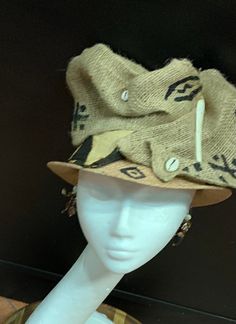 The art of the Zulu Hat. This hat is a cool classy look. It screams I'm Here. This is a wearable art hat. If you are looking for something Zulu, Kentucky Derby or just want to be different, this is the hat for you. This hat has 6 different looks. Every turn is a different look. Don't delay order yours today. Brown Curved Brim Straw Hat One Size, Beach Cap Felt Hat, Beach Cap Felt Hat One Size Fits Most, Beach-style Felt Cap One Size Fits Most, Brown Brimmed Hat One Size, One Size Straw Hat For Festivals, Bohemian Style Bucket Straw Hat, Bohemian One Size Bucket Straw Hat, Bohemian One-size Bucket Straw Hat